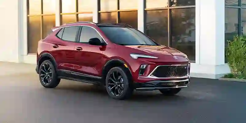 Red 2026 Buick Encore GX parked outside a modern building