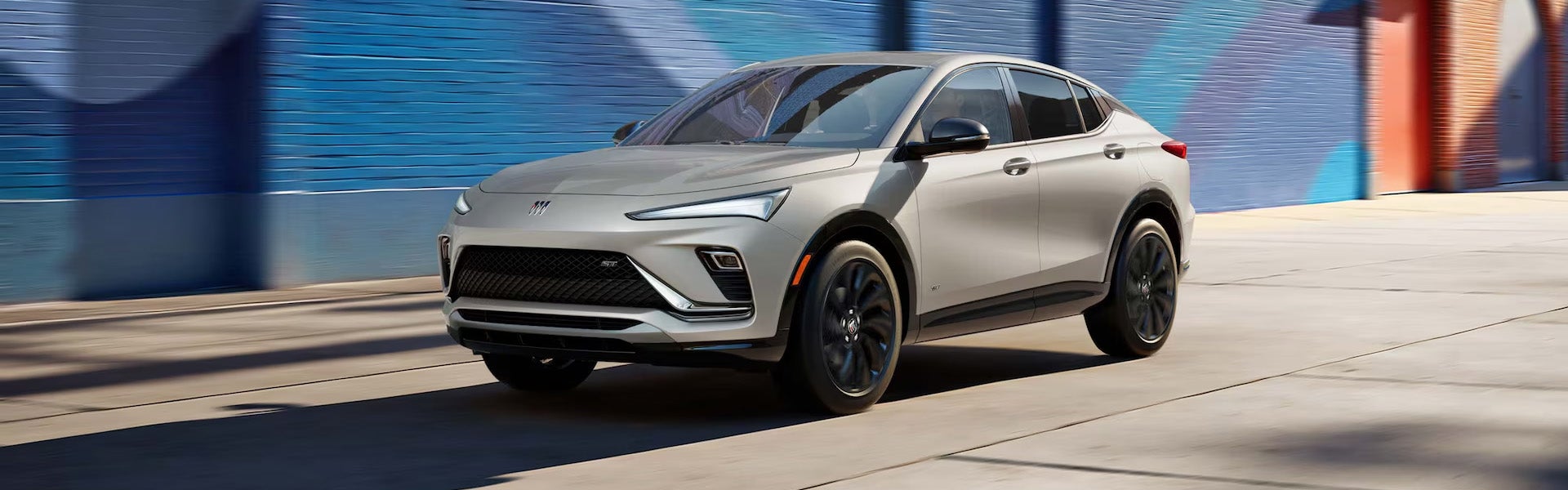 2026 Buick Envista parked in an urban setting with modern mural backdrop